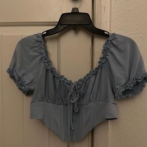 Blue corset crop top.